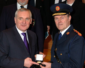 Taoiseach presenting first Ireland Medal